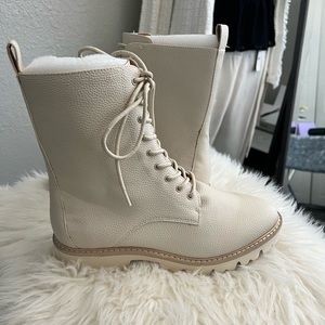 Cream leather combat boots.